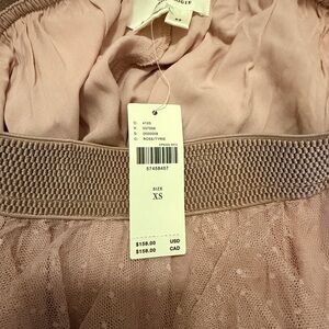 The Chéri Ruffled Tulle Midi Skirt by Anthropologie
 XS